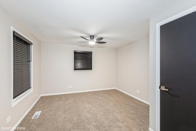 unfurnished room with carpet floors and ceiling fan