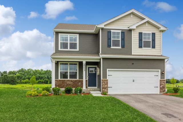 craftsman house with a garage and a front yard