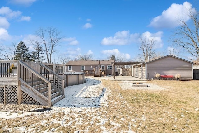 rear view of house featuring a wooden deck