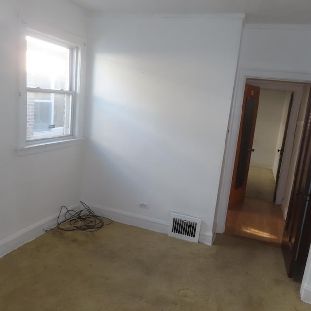 unfurnished room featuring carpet