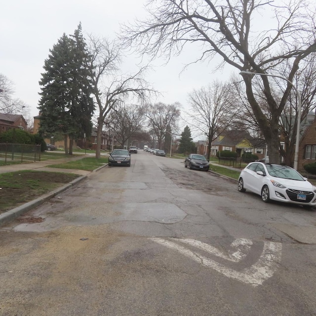 view of street featuring sidewalks, a residential view, and curbs