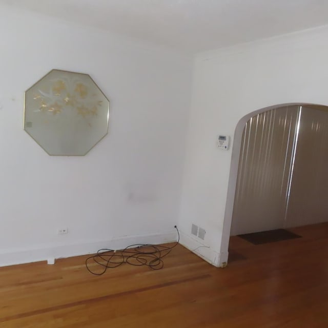 spare room featuring hardwood / wood-style floors