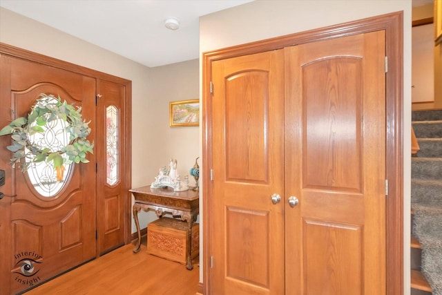 foyer entrance with light hardwood / wood-style flooring