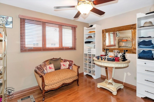 sitting room featuring ceiling fan and wood-type flooring