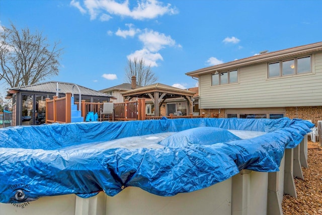 view of swimming pool featuring a gazebo