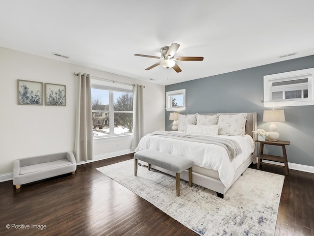 bedroom featuring ceiling fan and dark wood-type flooring