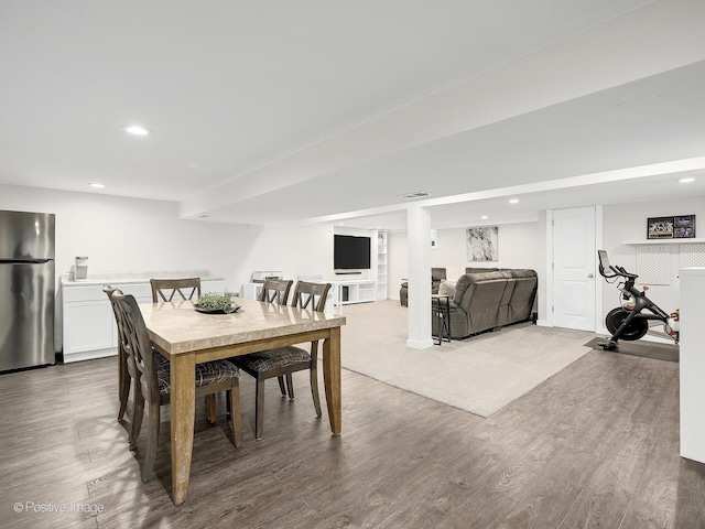 dining space featuring wood-type flooring