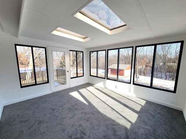 carpeted spare room with a skylight