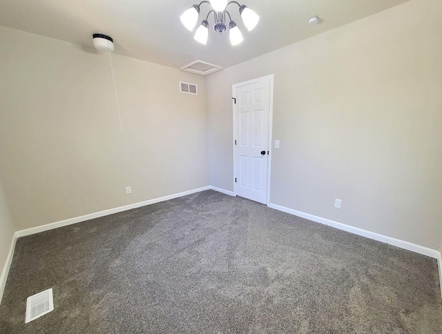 unfurnished room with dark carpet