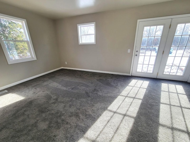 empty room featuring dark carpet