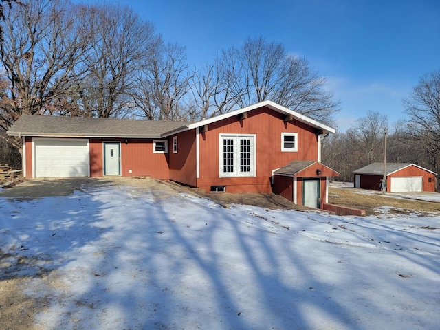 ranch-style house featuring a garage