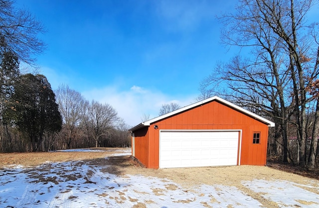 view of snow covered garage