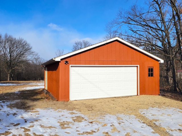 view of snow covered garage