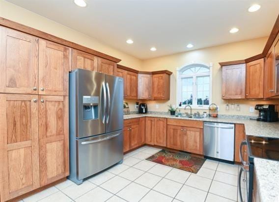 521 E 2700 N Rd, Deland, IL 61839 - kitchen with sink, stainless steel appliances, and light tile patterned flooring