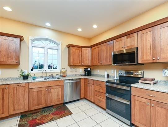 521 E 2700 N Rd, Deland, IL 61839 - kitchen featuring sink, stainless steel appliances, and light tile patterned floors