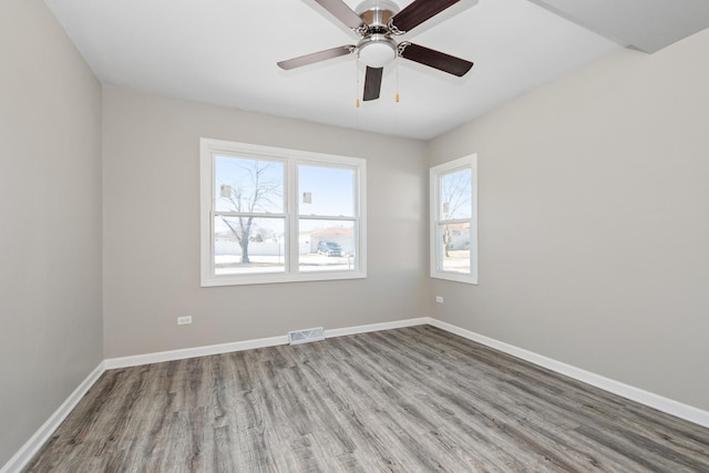 unfurnished room featuring light wood-type flooring and ceiling fan