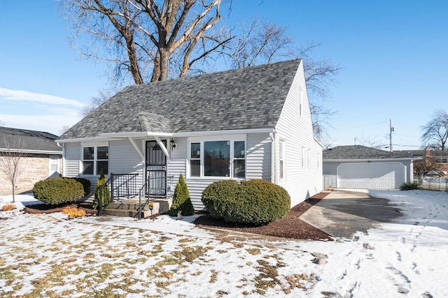 bungalow-style home featuring an outbuilding and a garage