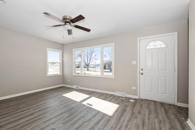 entryway featuring ceiling fan and dark wood-type flooring