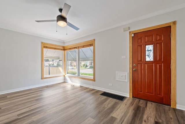 entryway with ceiling fan, crown molding, and hardwood / wood-style flooring