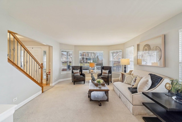 carpeted living room with a wealth of natural light