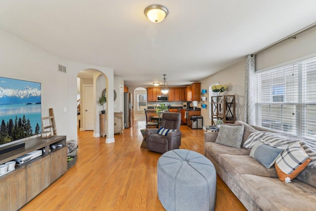 living room with light hardwood / wood-style floors