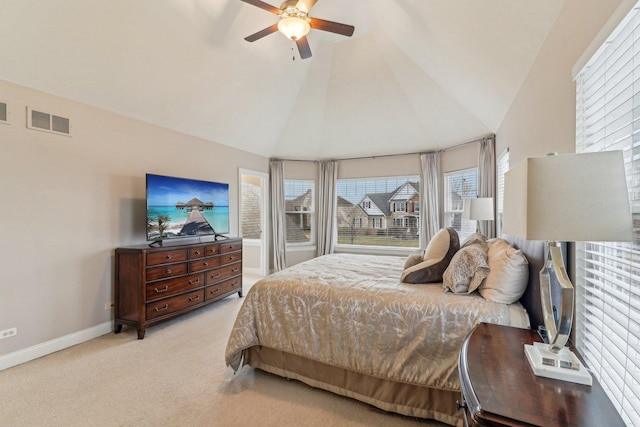 carpeted bedroom featuring ceiling fan and vaulted ceiling