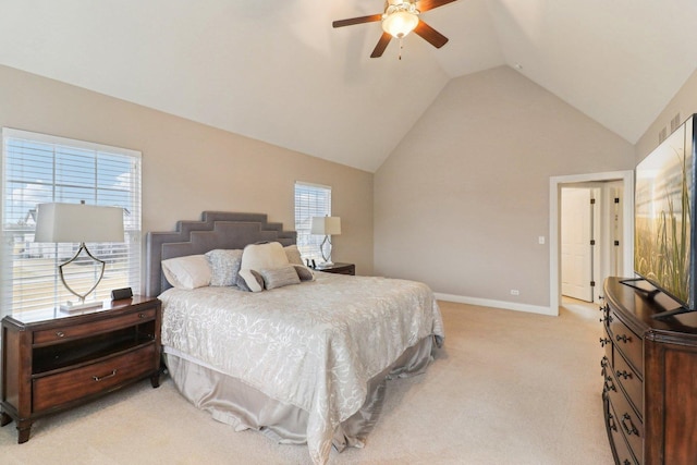 carpeted bedroom with vaulted ceiling and ceiling fan