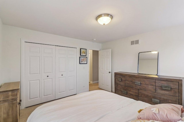 carpeted bedroom with a closet