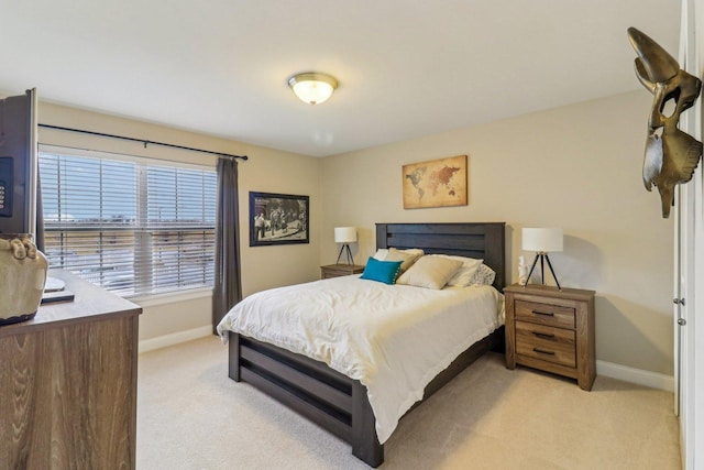 bedroom featuring light colored carpet