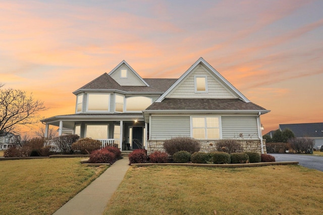 view of front facade featuring a yard and a porch