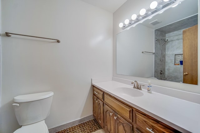 full bathroom featuring toilet, tiled shower / bath, and vanity