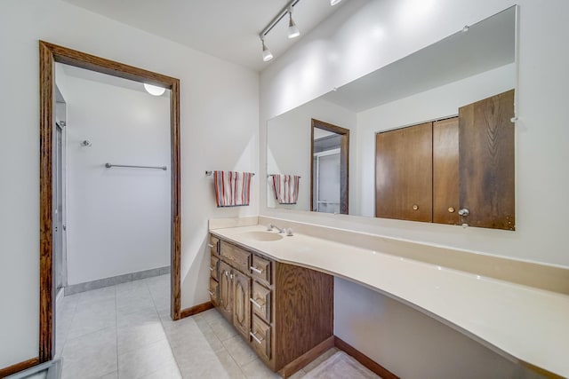 bathroom featuring tile patterned flooring and vanity