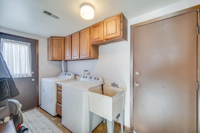 clothes washing area featuring cabinets, light tile patterned floors, sink, and independent washer and dryer