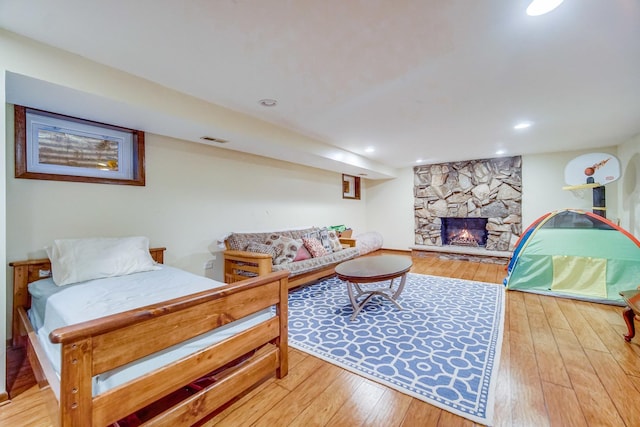 living room featuring a fireplace and hardwood / wood-style flooring