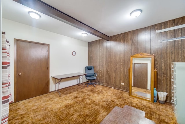 interior space with wood walls, carpet flooring, and beamed ceiling