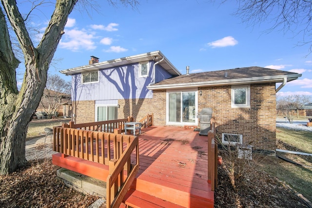 rear view of property with a deck