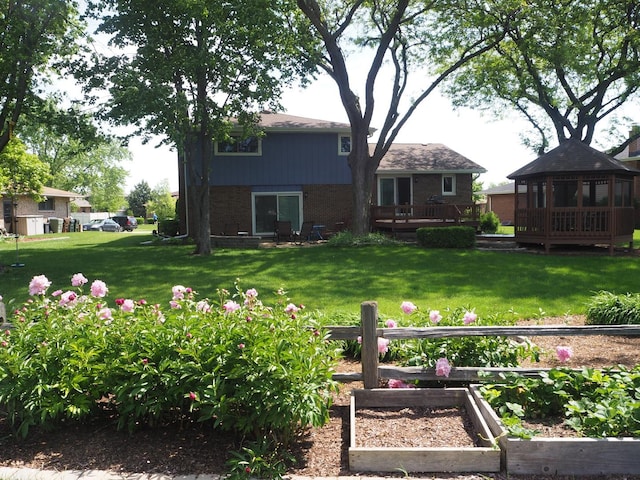 view of yard with a wooden deck and a gazebo