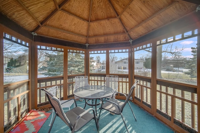 sunroom featuring wood ceiling