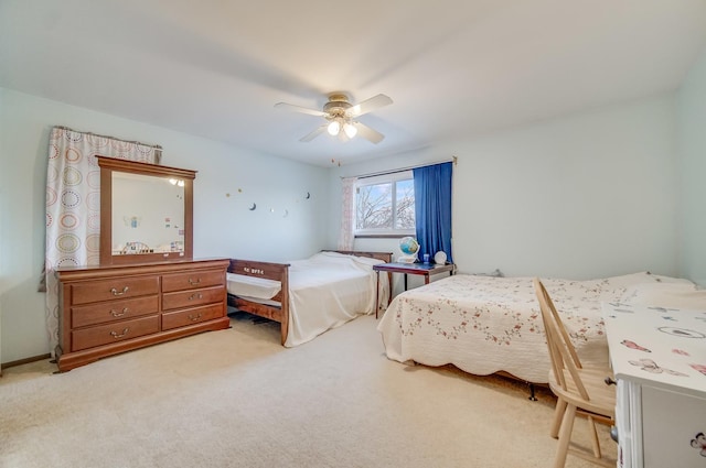 bedroom featuring ceiling fan and light carpet