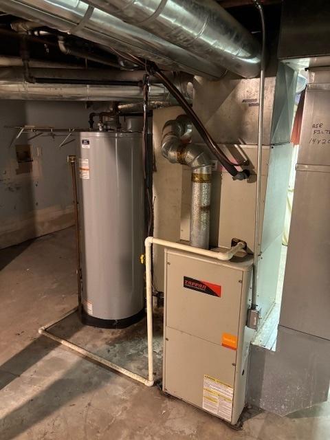 utility room featuring gas water heater