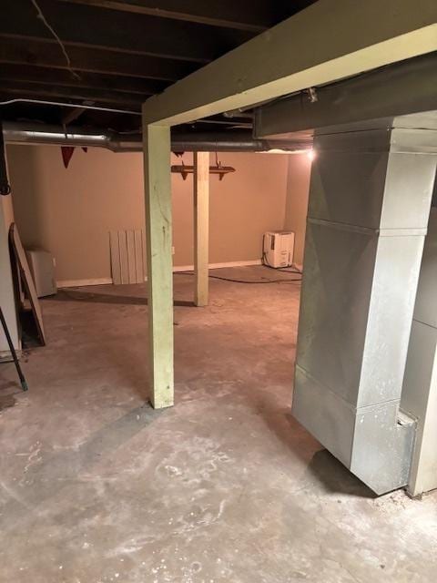 basement featuring heating unit