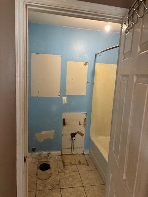 bathroom with tile patterned flooring and shower / bathing tub combination