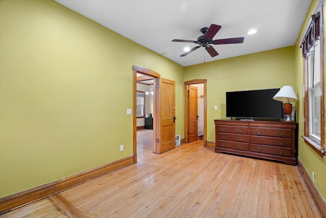 bedroom with ceiling fan and light wood-type flooring