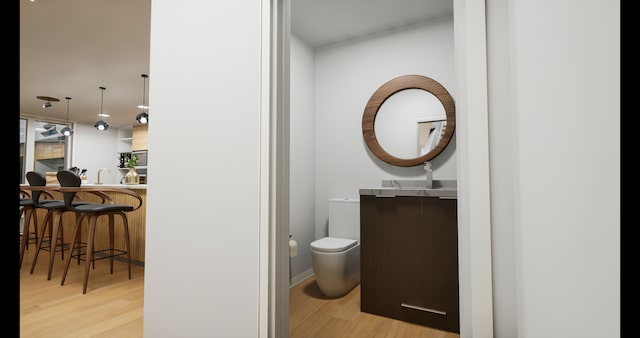 bathroom featuring toilet and hardwood / wood-style floors