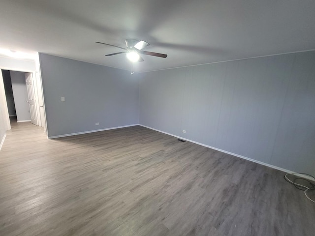 spare room featuring ceiling fan and wood-type flooring