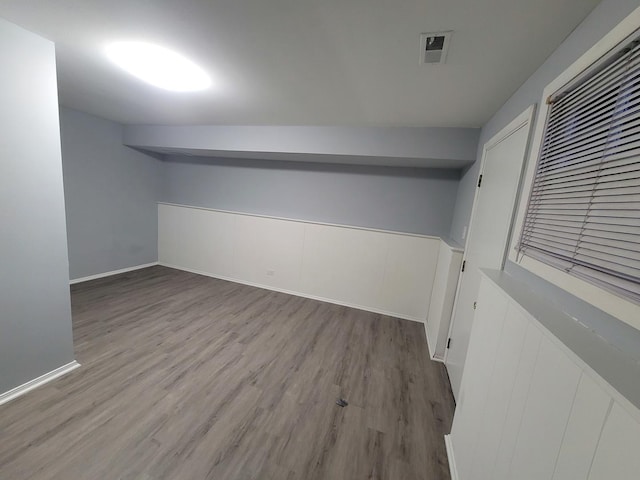 basement featuring light hardwood / wood-style floors