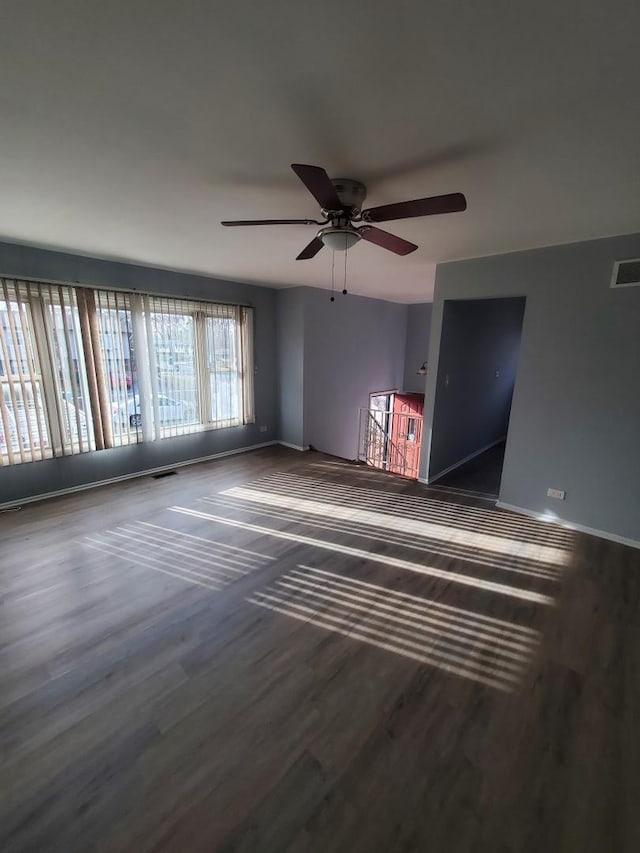 spare room featuring ceiling fan and hardwood / wood-style flooring