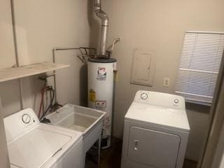 clothes washing area with washing machine and dryer and gas water heater