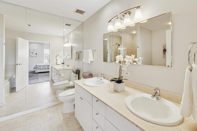 bathroom with vanity, a shower, and toilet