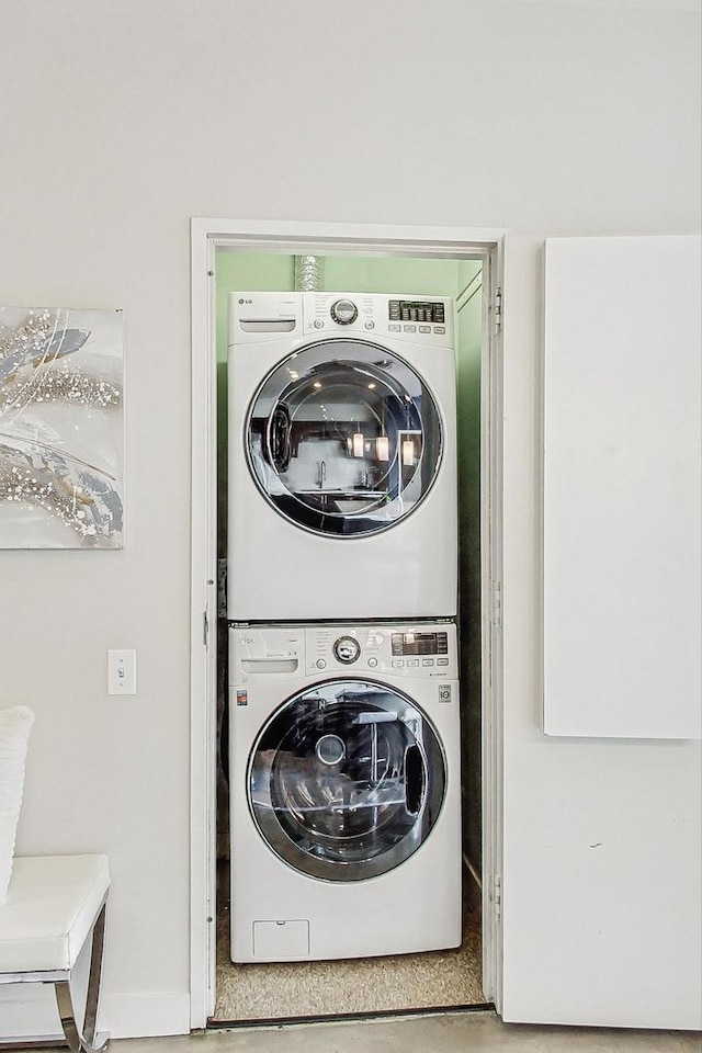 washroom with stacked washer and dryer